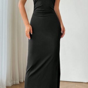 Black sleeveless midi dress with slit styled for a party