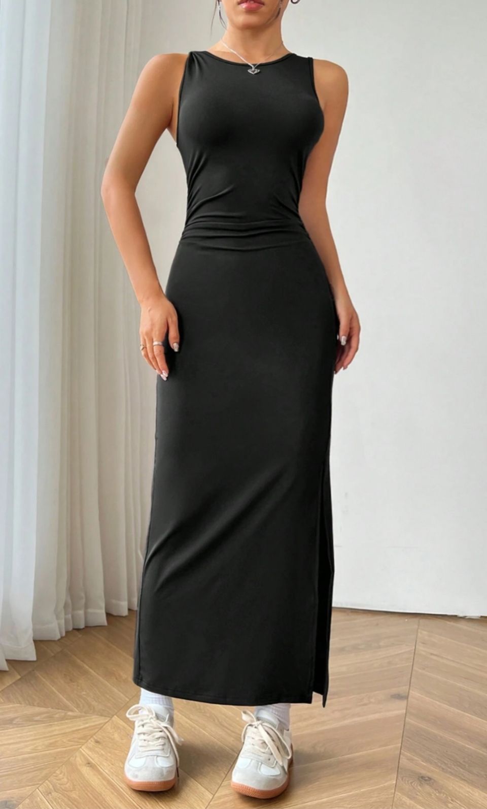 Sona Mart Black sleeveless midi dress with slit styled for a party