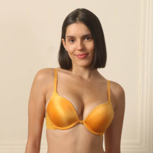 Model wearing a shiny golden-yellow push-up plunge bra with a decorative lace back wing.