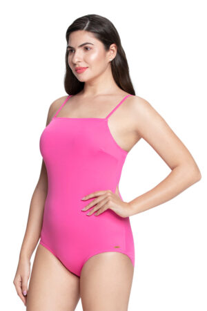 Model wearing a stunning Fandango Pink straight neck padded one-piece swimsuit with adjustable straps and full back coverage, perfect for a beach or pool getaway.