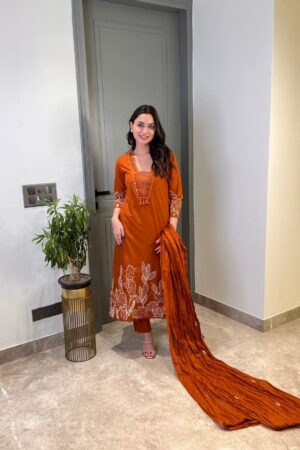 Model wearing a premium pure cotton 60x60 embroidered kurta pant and dupatta set featuring intricate thread work, available at Sona Mart