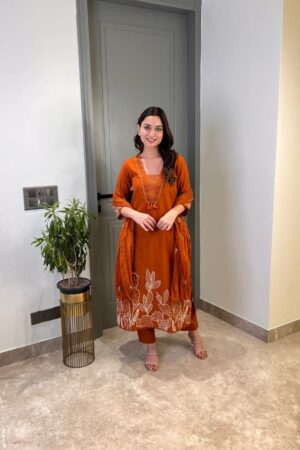 Model wearing a premium pure cotton 60x60 embroidered kurta pant and dupatta set featuring intricate thread work, available at Sona Mart