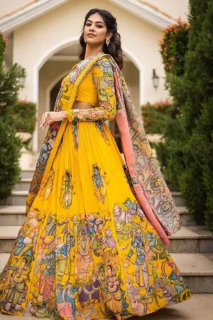 Model wearing a vibrant yellow fully stitched Roman cotton Kalamkari lehenga choli with beads and embroidery work by Pankhudi, available at Sona Mart.