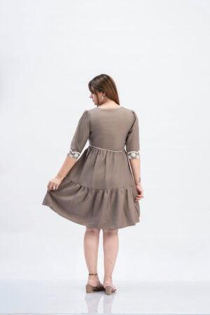 Detail shot of 3/4th lace sleeves on a women's festive flared dress