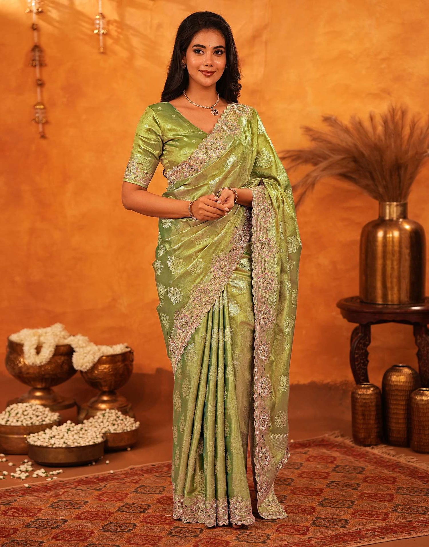 70144S121_1 Model wearing Sista Mart premium pista green silk woven embroidery saree with stone work