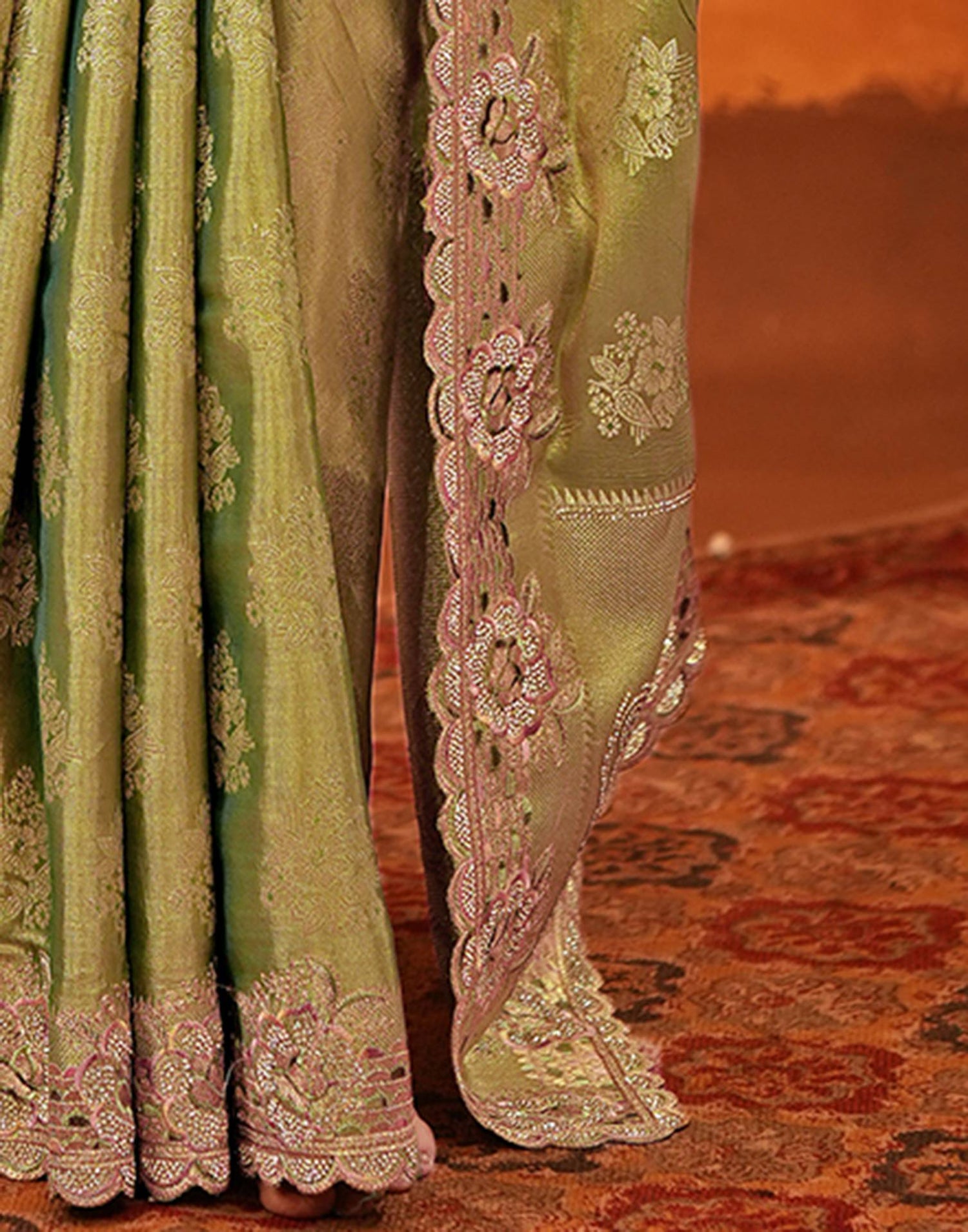 70144S121_10 Close up of scalloped border and embroidery on Sona Mart pista green silk saree