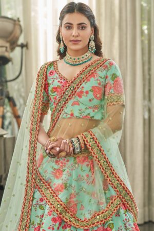 Close up of sequins dori and stone work on green silk lehenga by Sona Mart