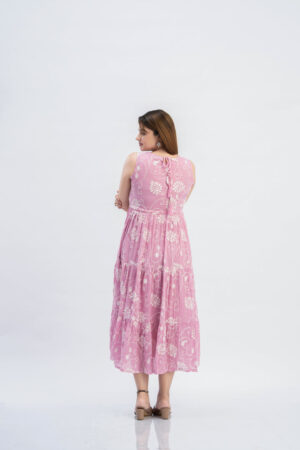 Full length view of flowy pink empire waist dress for festive wear