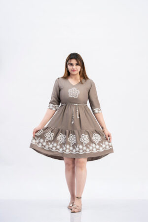 Woman wearing Sona Mart premium embroidered flared dress with tiered silhouette