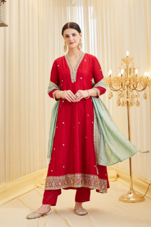 Woman wearing Sona Mart premium red embroidered silk Anarkali set with contrasting pastel dupatta.