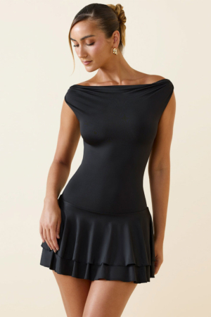 Close up of gathered off-shoulder neckline on black lycra dress.