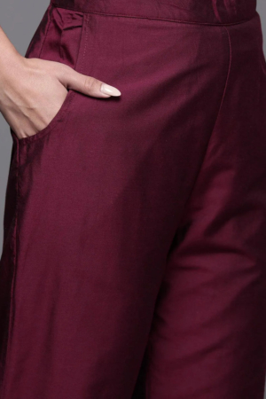 Full length view of burgundy ethnic party wear suit with matching trousers
