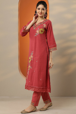 Woman wearing Sona Mart premium deep pink embroidered cotton suit set.