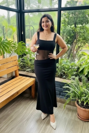 Woman wearing Sona Mart premium black mesh cutout maxi dress