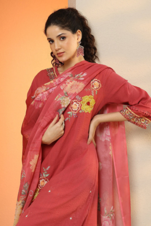 Woman wearing Sona Mart premium deep pink embroidered cotton suit set.