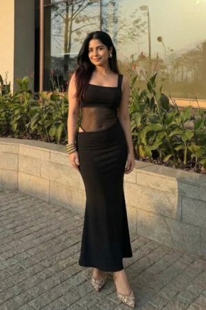Woman wearing Sona Mart premium black mesh cutout maxi dress