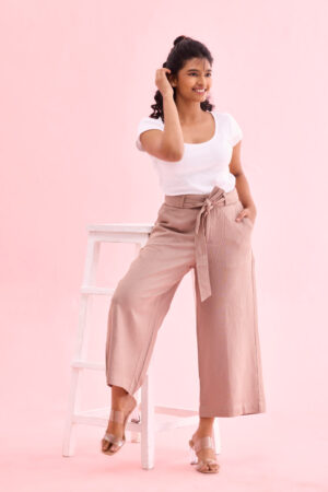 Full length view of relaxed fit 7/8th length linen trousers for women.