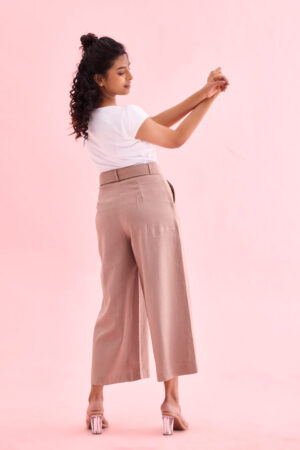 Woman wearing Sona Mart premium beige linen culottes with side pockets.